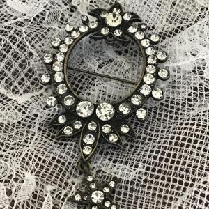 Photo of Black pin with Rhinestones and star