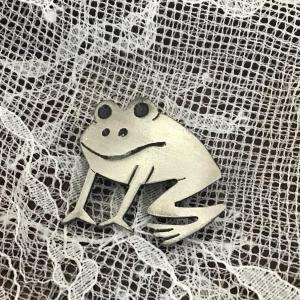 Photo of Frog pin stamped AJRCO