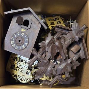 Photo of Box of 12 Clock Works & 2 Cases for Cuckoo Clocks