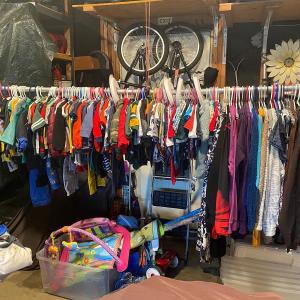 Photo of Garage Sale - Lots of kid clothing and items