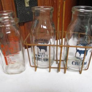 Photo of Set of Three Dairy Milk Bottles with Metal Carrier