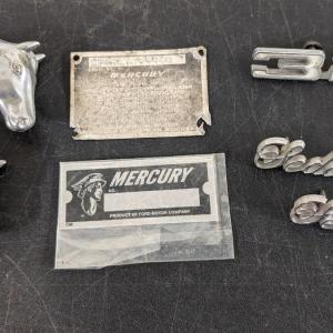 Photo of Mercury Plate, Vintage Stereo Knobs, and Emblems