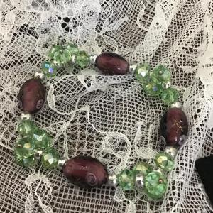 Photo of Green crystal and purple glass with painted flowers bracelet