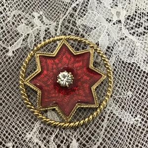 Photo of Red star on gold toned brooch with silver Rhinestone gem