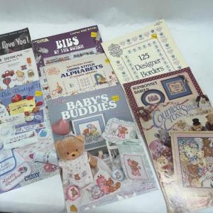 Photo of Lot of nine instruction books / patterns for baby cross-stich items