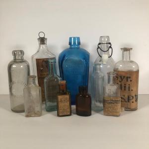 Photo of LOT 63L: Vintage Glass Bottles incl. Wheaton :Nectar of the Golden Life"