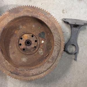Photo of 1928-31 Ford Model A Flywheel, Steering Column Drop Bracket, and Rear View Mirro
