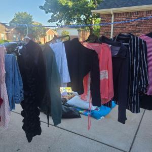 Photo of Garage sale.  Clothing and household items