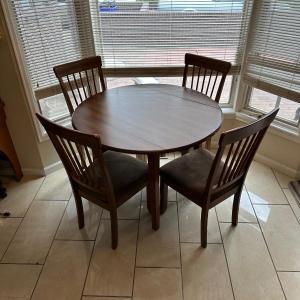 Photo of ROUND DRUM DROP LEAF TABLE WITH 4 SEAT CUSHIONED CHAIRS