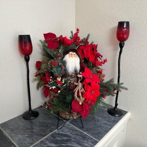 Photo of CANDLE HOLDERS AND SANTA IN FLORAL SLEIGH BASKET