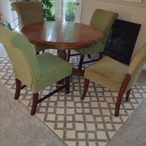 Photo of Solid Wood Dining Table with Four Upholstered Chairs