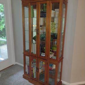 Photo of Lighted Breakfront Curio Cabinet with Glass Shelves