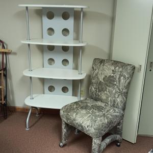 Photo of UPHOLSTERED CHAIR ON CASTERS AND A 4 TIER STAND