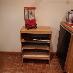 Photo of 3 SLIDING SHELVE CART, POPCORN MAKER, TOSHIBA DVD PLAYER AND ROUND COFFEE TABLE 