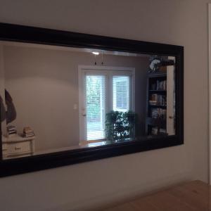 Photo of Beveled Wall Mirror with Composite Frame- Approx 45" x 25"