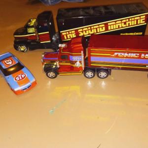 Photo of 2 PLASTIC SEMI TOYS AND A STP RACE CAR
