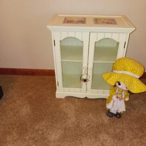 Photo of SWEET LITTLE DISPLAY CABINET, A WICKER CHAIR AND A PAPER MACHE DOLL