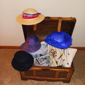 Photo of DECORATIVE CHEST FILLED W/LADIES HATS AND THROW PILLOWA