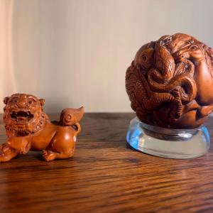 Photo of Chinese carved sphere and foo dog
