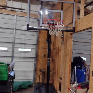 Photo of Lifetime Adjustable Basketball Goal with Weighted Base and Shatter-Proof Glass L