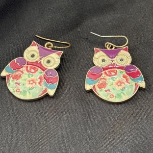 Photo of Gold tone owl earrings with floral middle