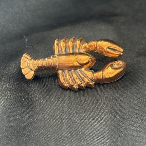 Photo of Gold tone bronze colored lobster pin