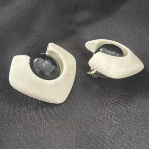 Photo of White and black plastic vintage clip on earrings