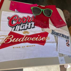 Photo of Towels & really big sunglasses