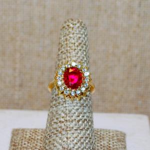 Photo of Size 6½ Nice Red Oval Center Stone Ring with Glitter Clear Stones Surround on a