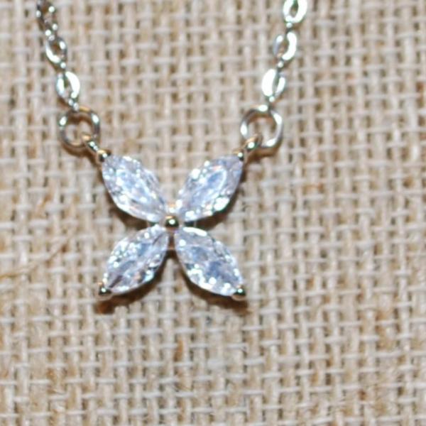 Photo of Four Petals Flower PENDANT (½" x ½") on a Silver Tone Necklace Chain 18" L