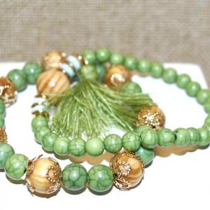 Photo of 2 Piece Green Expandable Bracelet Set with "Crown" Beads & Tassel 3" Diameter