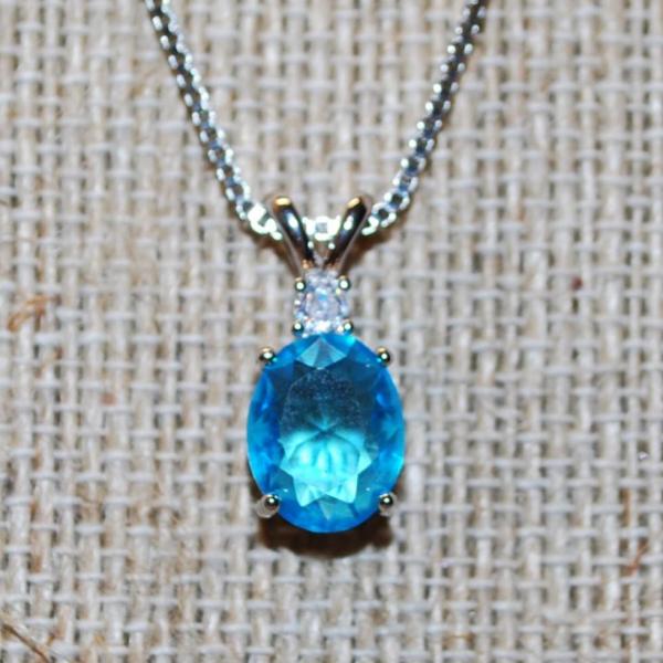 Photo of Oval Cut Sea Blue Stone with a Clear Stone on Top PENDANT (½" x ¼") and Double