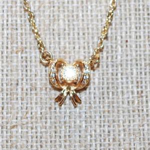 Photo of Clear Stones Array Gold Bowtie PENDANT (½" x ½") on a Gold Tone Necklace Chain