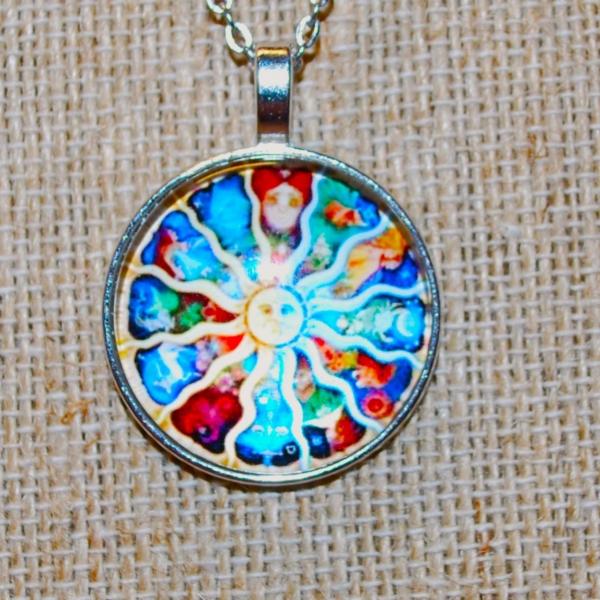 Photo of Round Graphic Designed "Sun god" PENDANT (1" Diam.) on a Silver Tone Necklace Ch
