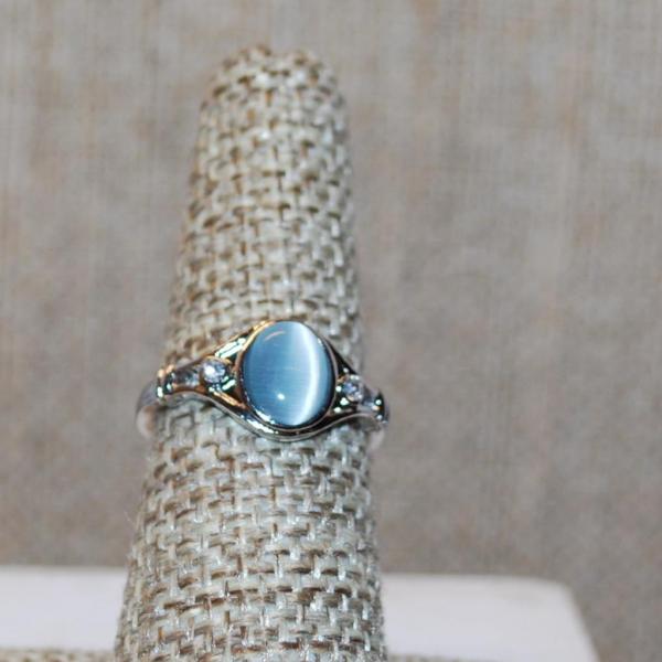 Photo of Size 6½ Oval Light Blue Iridescent Reflecting Stone Ring with Single Stone Side