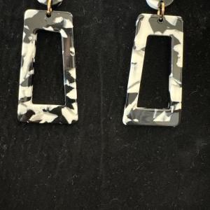 Photo of Black-and-white plastic type fashion earrings