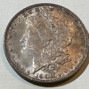 Photo of 1896-P TONED UNCIRCULATED CONDITION MORGAN SILVER DOLLAR AS PICTURED.