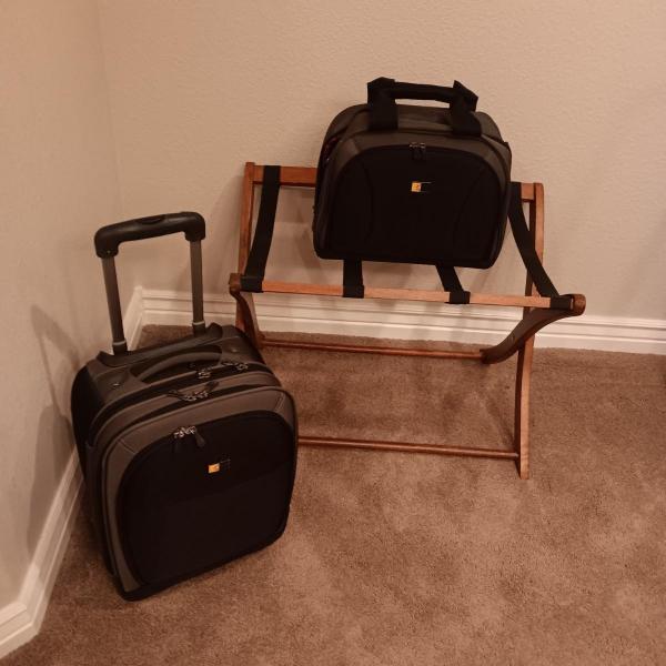 Photo of CASE LOGIC SUITCASE ON 2 WHEELS AND CARRY-ON PLUS A FOLDING LUGGAGE RACK