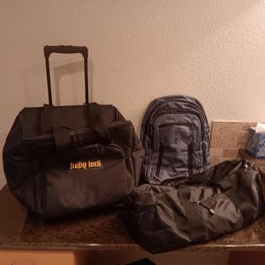 Photo of BABY LOCK CANVAS BAG ON 2 WHEELS, BACKPACK AND 2 SMALLER DUFFLE BAGS