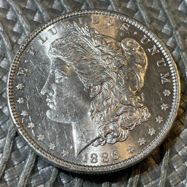 Photo of 1886-P UNCIRCULATED CONDITION MORGAN SILVER DOLLAR (COIN #2) AS PICTURED.