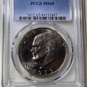 Photo of PCGS CERTIFIED 1973-P MS65 GRADED EISENHOWER DOLLAR AS PICTURED.
