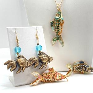 Photo of LOT 82: Gold Tone Necklace with Set of Articulated Fish Pendants and Pair of Dan