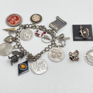 Photo of LOT 99: Sterling Charm Bracelet with Extra Charms - TW 42.5g