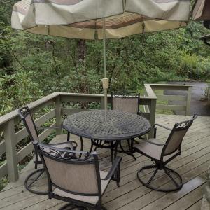 Photo of Wrought Metal Five Piece Patio Set with Swivel Style Chairs includes Umbrella