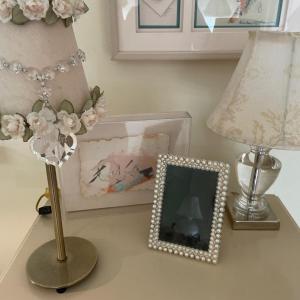 Photo of 2 lamps, frame and paper art
