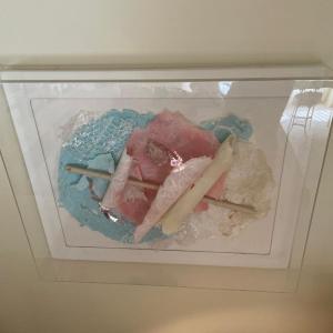 Photo of Teal and pink 3d art in acrylic box