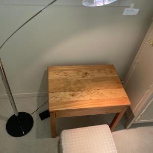 Photo of Lamp with wood color table & cream footstool