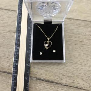 Photo of Gold tone heart charm necklace and earrings set